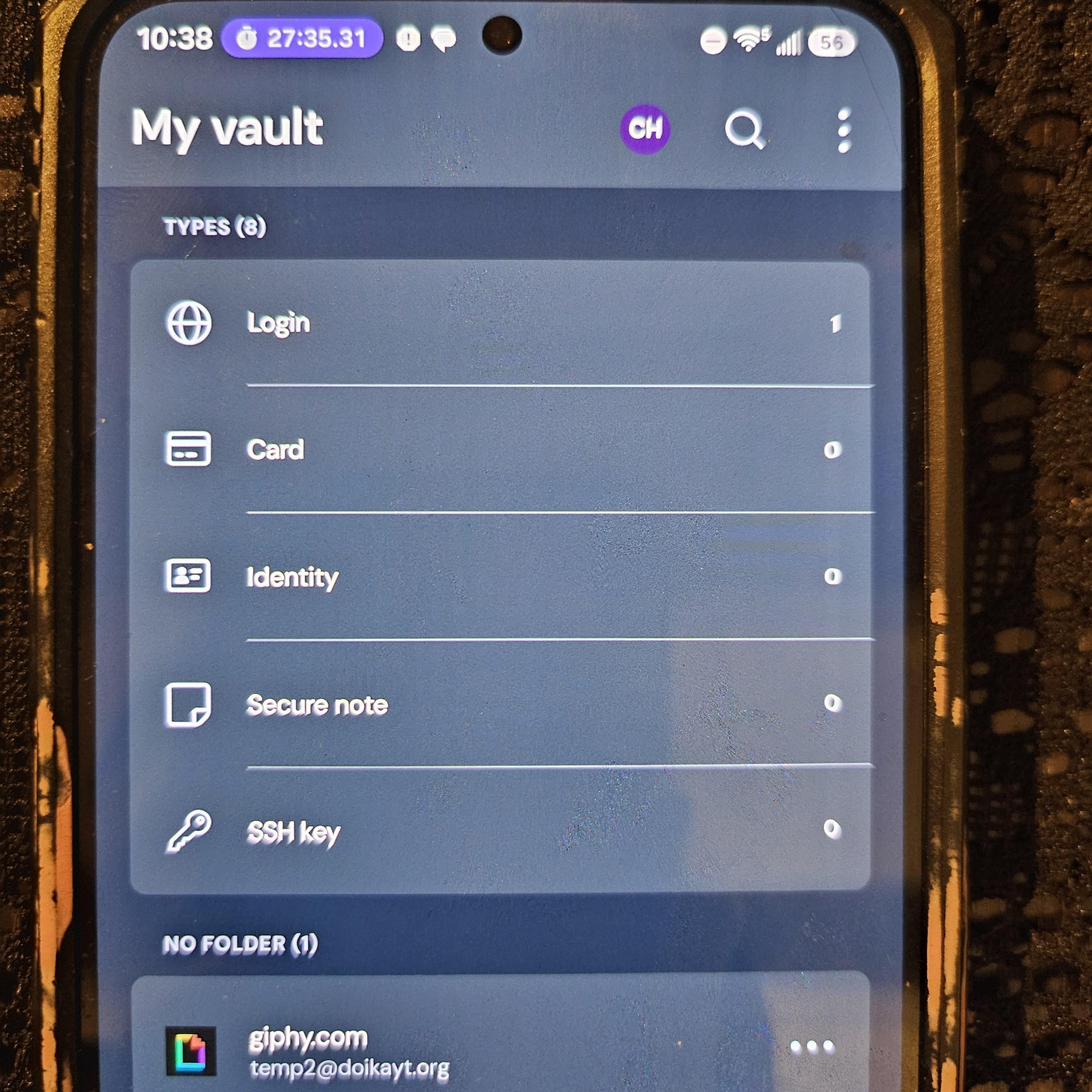 Bitwarden's Android vault, showing the giphy.com login synced from desktop